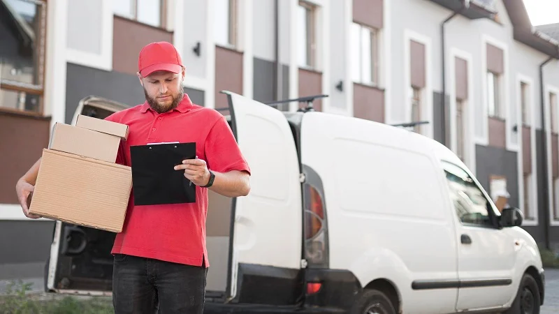 front-view-delivery-man-with-package